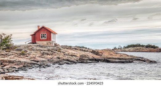 Red House At Sea Shore In The Baltic Sea In Dull Colors In Autumn