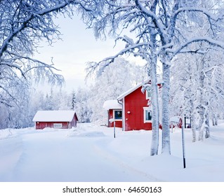 Red House In Snow Fairy Forest. Finland