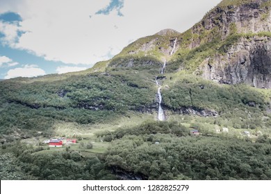 Red House And Waterfalls In Famous Flam (Flåm) Valley, Norway