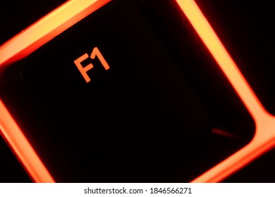 Red Illuminated Keyboard F1 Key Closeup