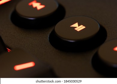 Red Illuminated Keyboard Play Pause Key Closeup