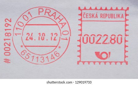 red ink postage meter from Prague over white envelope