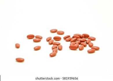 red iron tablets on white background