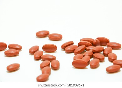red iron tablets on white background