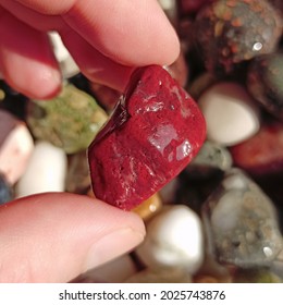 Red Jasper Stone In Hand Close Up