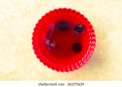 Red Jelly With Berries In Red Silicone Mold