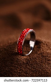 Red Jewellery Ring On Brown Background