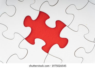 Red Jigsaw Puzzle Pieces On Red Background. Copy Space And Business Concept