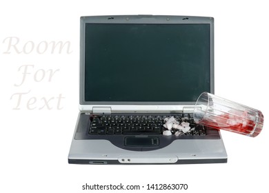 Red Juice Spill On Laptop Computer. Computer Damage Caused By Spilled Glass Of Juice On Keyboard. Computer And Laptop Repair Concept. Isolated On White. Room For Text. Data Recovery Concept.
