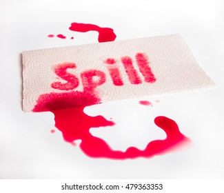 Red Juice Spill With Word And Paper Towel On White Surface