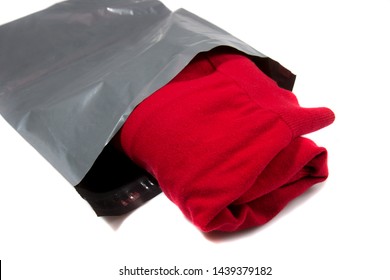 Red Jumper Packed In Gray Mailing Bag