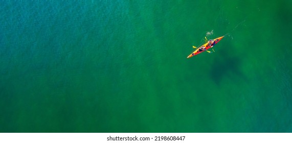Red Kayak Boat Two Rowers On Blue Turquoise Water Sea, Sunny Day. Concept Teamwork For Business Plan, Aerial Top View.