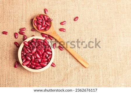 Red kidney beans, dried beans in a wooden bowl on sackcloth, healthy food, vegan, plant protein, copy space. Stock foto © 