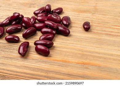 Red Kidney Beans On Wood Background. Cooked Bean Pile, Baked Legume, Canned Red Beans, Rajma, Phaseolus Vulgaris, Leguminous Salad Ingredient