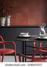 Red kitchen chairs plates clack metal table white vases red square wall