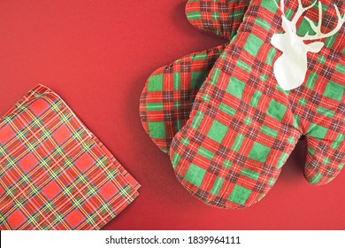 Red Kitchen Checkered Christmas Gloves. Christmas Oven Protective Mitt. New Year And Christmas Concept.