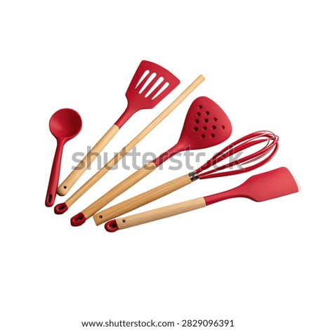 Red kitchen utensils set on wooden handles