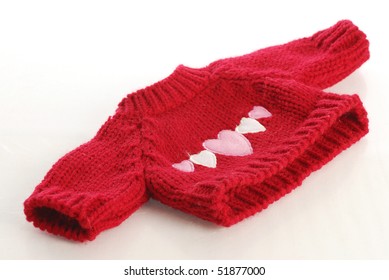 Red Knit Sweater With Hearts On The Front Isolated On White Background