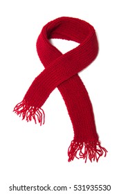 Red Knitted Scarf On A White Background.