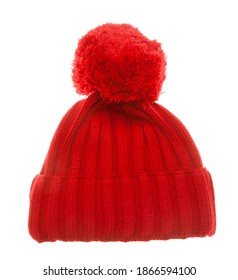 Red Knitted Winter Bobble Hat Of Traditional Design Isolated On White Background. Handmade Woolly Cap With Pompom On Top