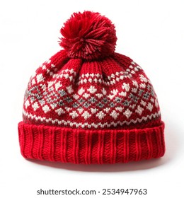 Red knitted winter bobble hat of traditional design isolated on white background