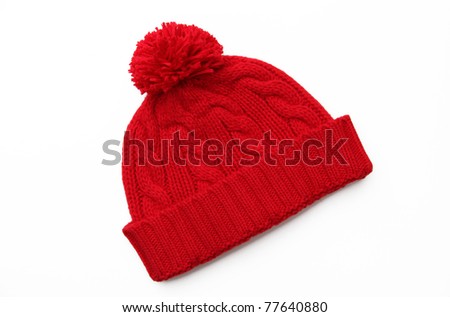 Red knitted wool hat isolated on white