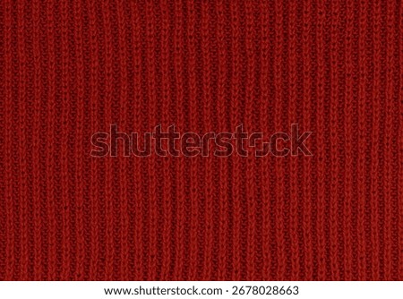 Red knitted wool texture background. High quality photo