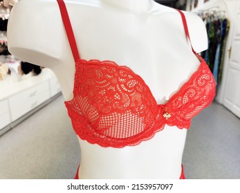 Red Lace Bra On A White Mannequin In The Shop Floor. Lingerie.