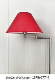 Red Lampshade Against A White Wall