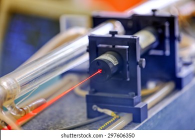 Red laser on optical table in physics laboratory
