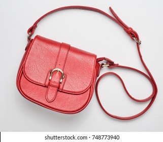 Red Leather Bag On A White Background. Fashionable Women's Accessories. Top View.