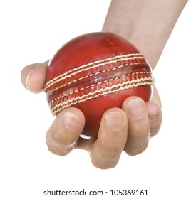 red leather cricket ball in hand on white background with copy space - Powered by Shutterstock