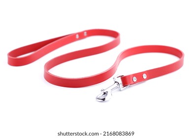 Red leather dog leash isolated on a white background