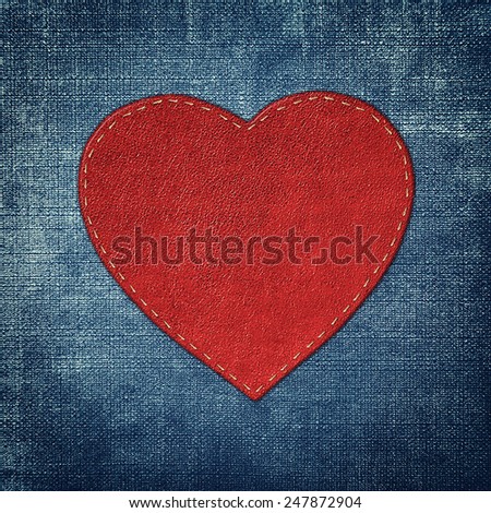 red leather heart on fabric in grunge style