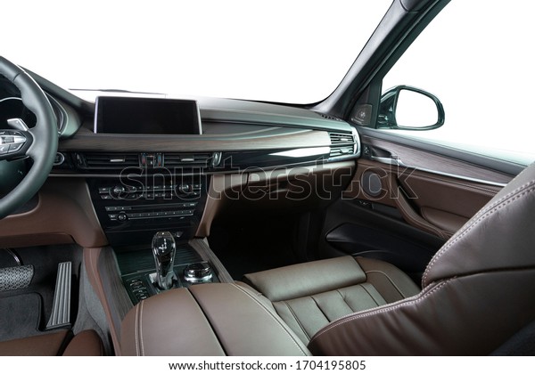 Red leather luxury car inside Interior -\
steering wheel, shift lever and dashboard.\
