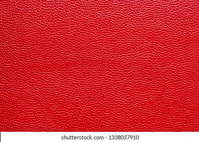 Red leather for manufacturing of shoes, clothes, bags and other fashion accessories, high quality natural seamless material sample, textured background, top view - Shutterstock ID 1338037910