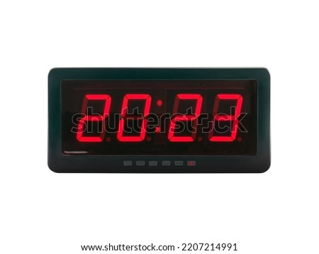 red led light numbers 2023 illuminated on black digital electric alarm clock display isolated on white background, led sign showing time symbol concept for new year countdown