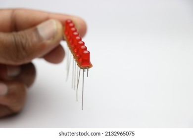 Red LED On An Empty Circuit Board Arranged In Parallel Circuit Connection. Young Inventor Working On Some LED Project