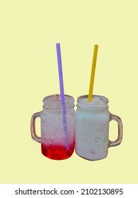 Red Lemon Soda And Fresh Milk Shake Pipo On Isolated Pale Yellow Background. 