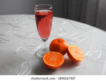 Red lemonade with oranges on the table     