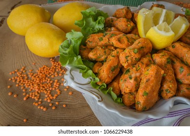 Red Lentil Balls Served With Lemons