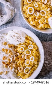 Red Lentil Dahl Dish With Peanuts And Fresh Onions Accompanied By Rice