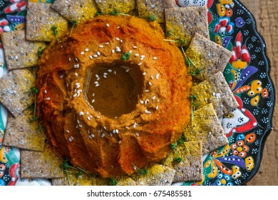 Red Lentil Hummus In Traditional Plate On The Wooden Table