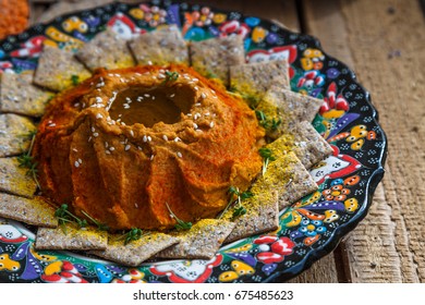 Red Lentil Hummus In Traditional Plate On The Wooden Table