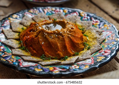 Red Lentil Hummus In Traditional Plate On The Wooden Table