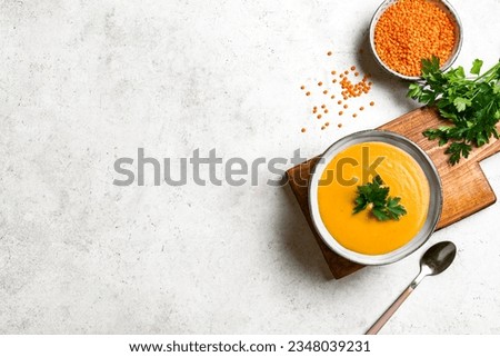 Red lentil soup on white background, copy space. Traditional middle eastern, turkish , ramadan cuisine. Vegan food . 