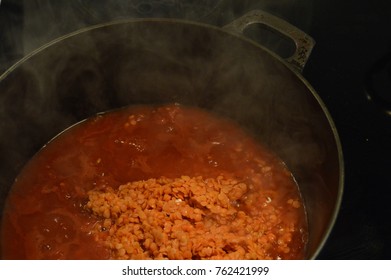 Red Lentil Soup Or Stew Cooking On The Stovetop.