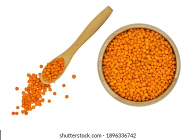 Red Lentil In Wooden Bowl And Spoon Isolated On White Background