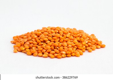 Red Lentils On White Background