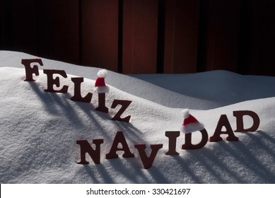 Red Letters With Santa Hat On White Snow As Christmas Card.  Spanish Text Or Word Feliz Navidad Means Merry Christmas. Snowy Scenery And Atmosphere. Rustic Vintage Wooden Background - Powered by Shutterstock